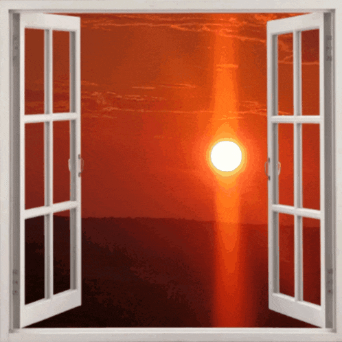 an open window shows a sunset with the sun shining brightly