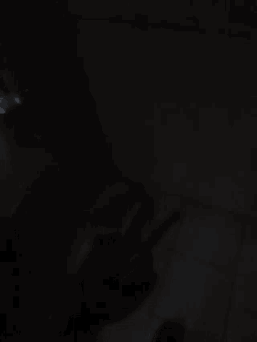 a dark room with a few lights on