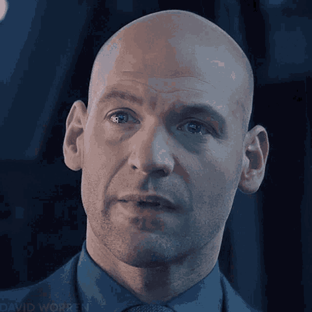 a close up of a man 's face with the name david worken visible