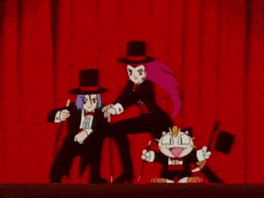 a group of people are sitting in an auditorium watching a group of people on stage .