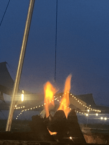 a fire is lit up in a dark room
