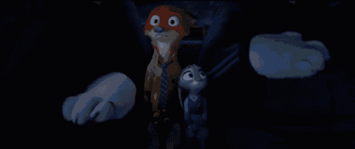 a couple of cartoon characters are standing next to each other in the dark .
