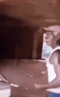 a blurry picture of a man in a hat