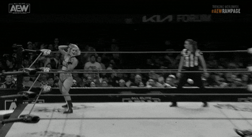 a woman in a wrestling ring with the aew logo on the bottom right