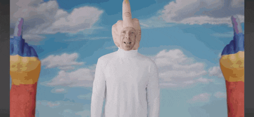 a man wearing a white turtleneck and a hat with a middle finger on his head