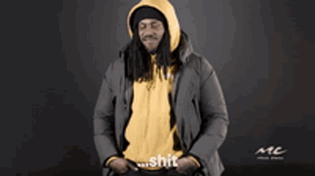 a man in a hooded jacket says shit