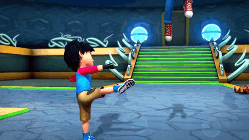 a boy in a blue shirt is kicking a ball
