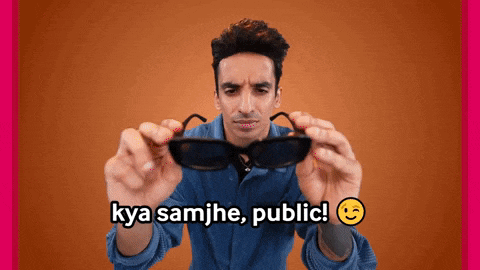 a man is holding a pair of sunglasses with the words kya samjhe public written below him