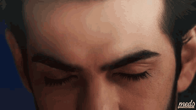 a close up of a man 's face with the word meds on the bottom right