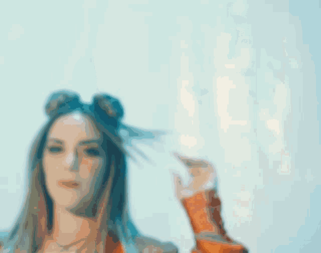 a woman wearing a red jacket and two buns on her hair