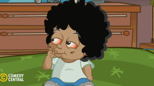 a cartoon character from comedy central sits on a green carpet