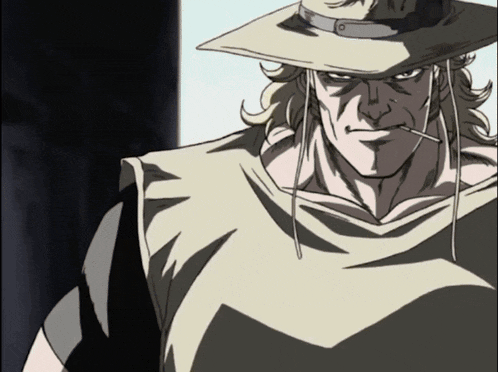 a man in a cowboy hat is smoking a cigarette in his mouth