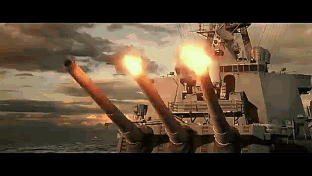 a battleship is firing its cannons in the water