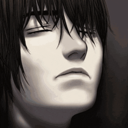 a close up of a person 's face with a serious look on their face