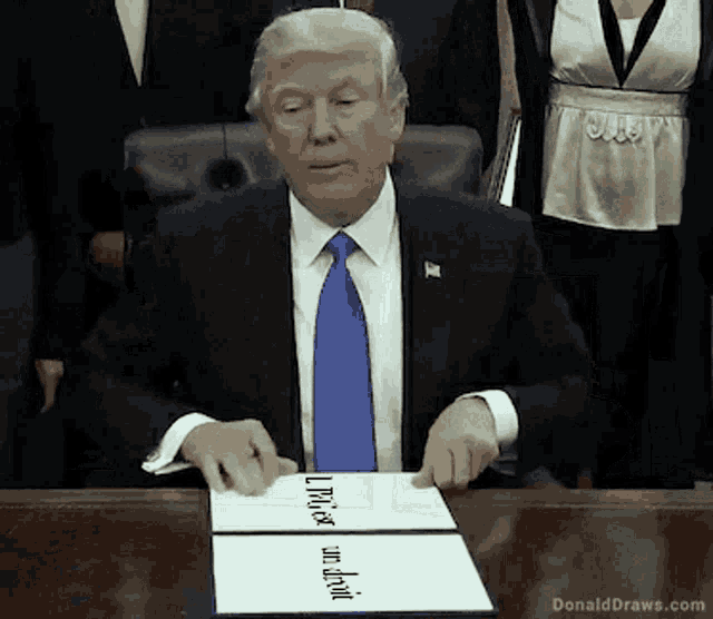 donald trump is sitting at a desk with a piece of paper that says ' please and thank you ' on it