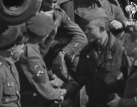 a black and white photo of soldiers with the pathe logo