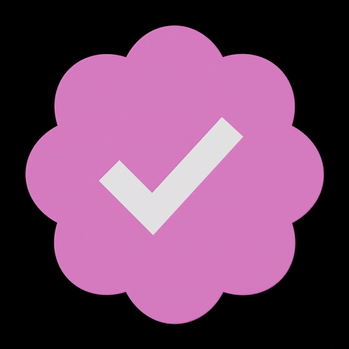 a pink circle with a white check mark inside