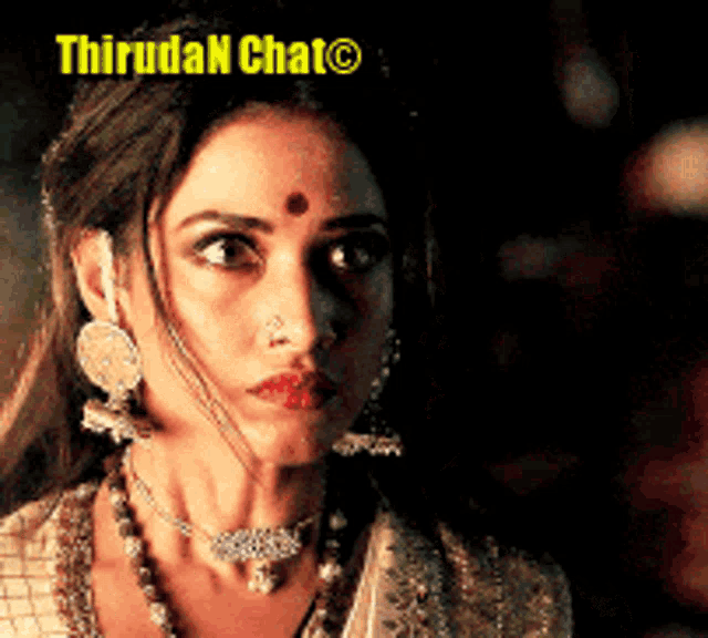 a close up of a woman 's face with the words thiruda chat on the bottom right