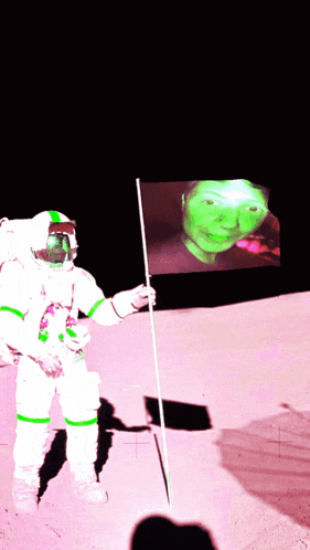 an astronaut is holding a flag in front of a screen