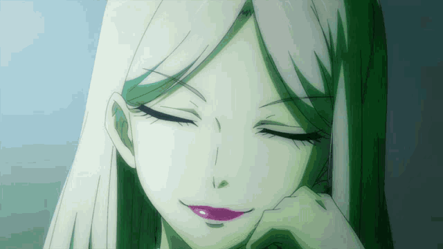 a close up of a woman 's face with her eyes closed and her hand on her chin