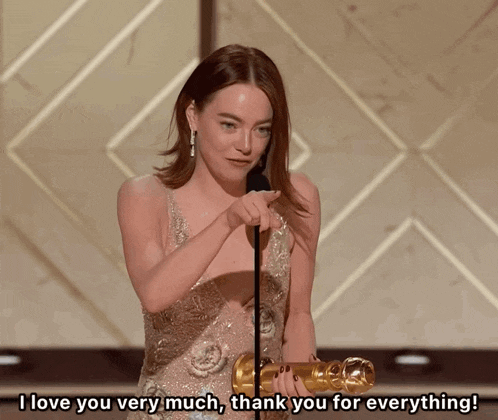 a woman holding an oscar says i love you very much and thank you for everything