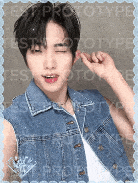 a boy wearing a denim vest winks at the camera with the words test prototype written behind him