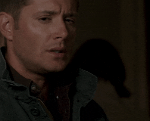 a close up of a man 's face with a jacket on