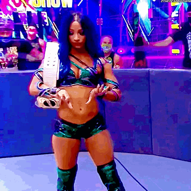 a female wrestler in a ring with the word show behind her