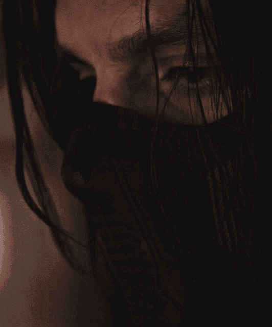 a close up of a person 's face with a black mask