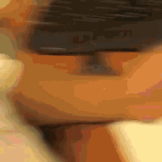 a blurry picture of a person 's face with a blurred background