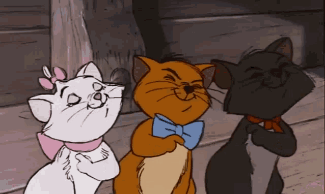 three cartoon cats are standing next to each other and one of them is wearing a bow tie
