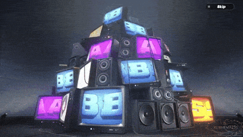a stack of televisions and speakers with the letters be on them