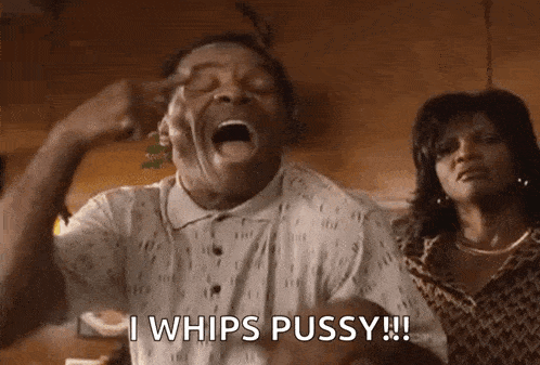 a man is screaming with his mouth open and the words `` i whips pussy '' written on the screen .