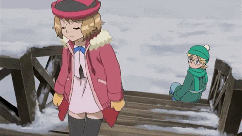 a girl in a pink coat is standing next to a boy in a green hat on a snowy bridge .