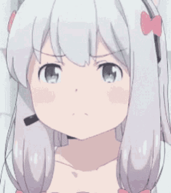 a close up of a girl 's face with white hair and a pink bow on her head .