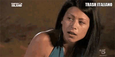 a woman is looking at the camera with the words trash italiano written on the bottom
