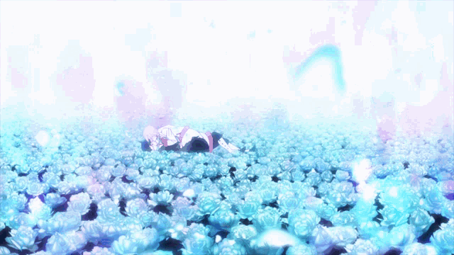 a girl is laying in a field of blue flowers
