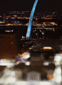 a blurry picture of a city at night with a sign that says kraft on it