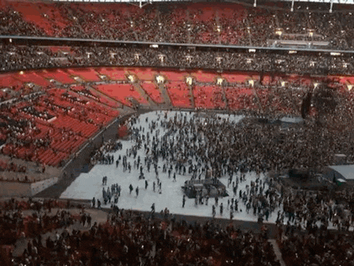 a large crowd of people gathered in a stadium