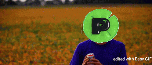 a man is holding a can of soda and has a green p on his head
