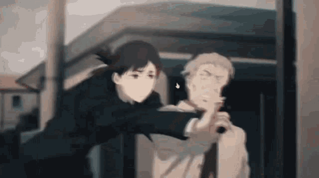 a man in a suit and tie is pointing a gun at another man .