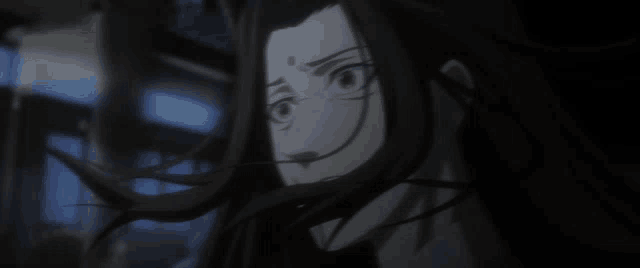 a close up of a person 's face with long hair