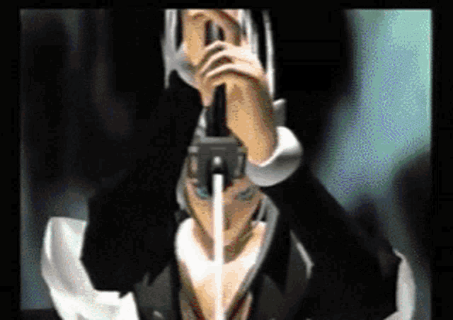 a man in a suit and tie is holding a gun