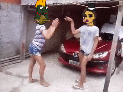 two girls are dancing in front of a honda car