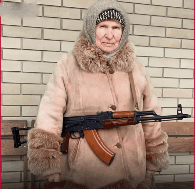 an elderly woman in a fur coat is holding a rifle