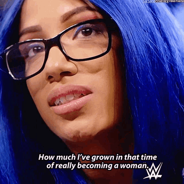 a woman with blue hair wearing glasses says how much i 've grown in that time of really becoming a woman