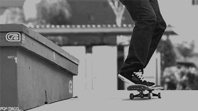 a black and white photo of a person riding a skateboard on a ramp .