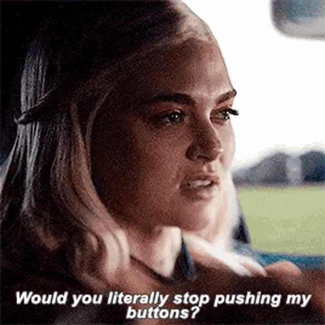 a woman is sitting in a car and talking to another woman .
