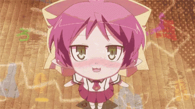 a little girl with pink hair and green eyes is sitting on a wooden floor .