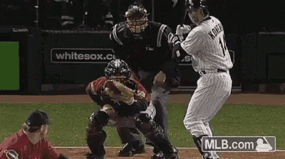 a baseball player with the number 11 on his jersey is swinging at a pitch